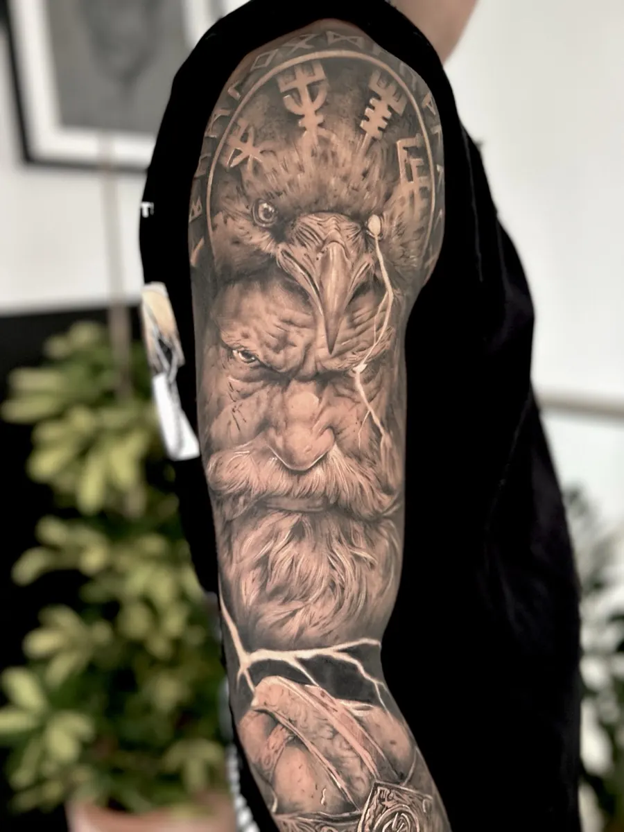 Black and grey realism piece on the arm